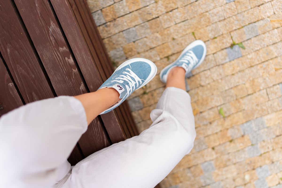 Light blue barefoot sneakers worn during natural walking