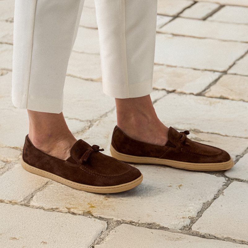 Brown barefoot loafers worn with white trousers