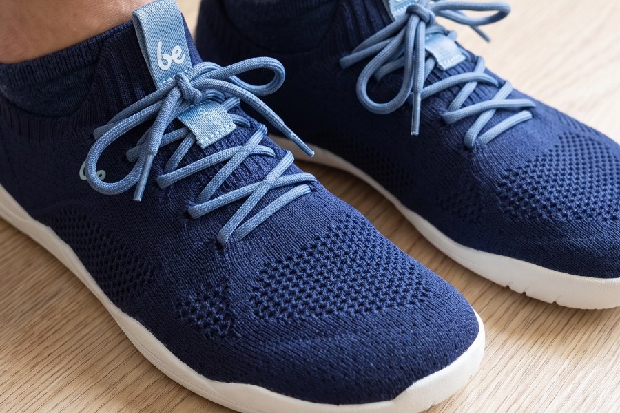 Close-up of navy women's spring barefoot shoes with a knitted upper Close-up of navy women's spring barefoot shoes with a knitted upper