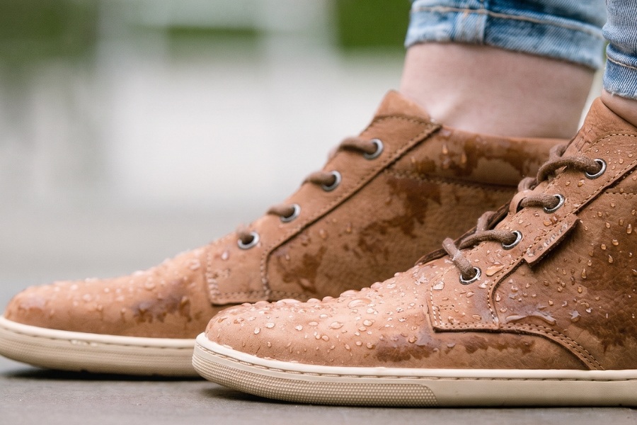 Close-up of brown women's autumn barefoot shoes with water droplets resisting moisture Close-up of brown women's autumn barefoot shoes with water droplets resisting moisture